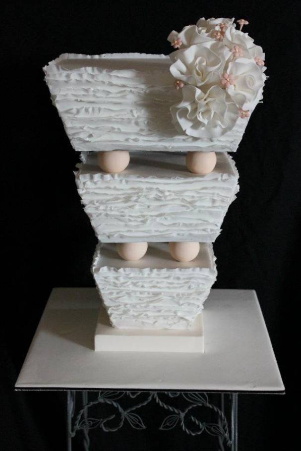 White and Ruffled Upside Down Wedding Cake
